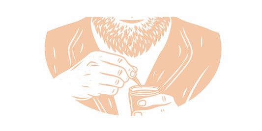 A man grooming his full beard with premium tallow beard balm
