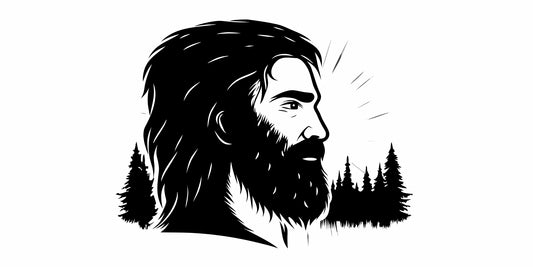 A man with a healthy beard in a pine forest, cared for with an all natural beard balm.