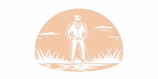 Active man with well-groomed beard standing on a golf course at sunrise