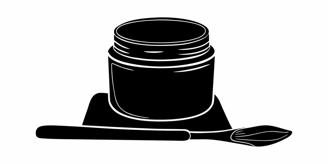 Best tallow face balm for men in a jar next to an applicator.