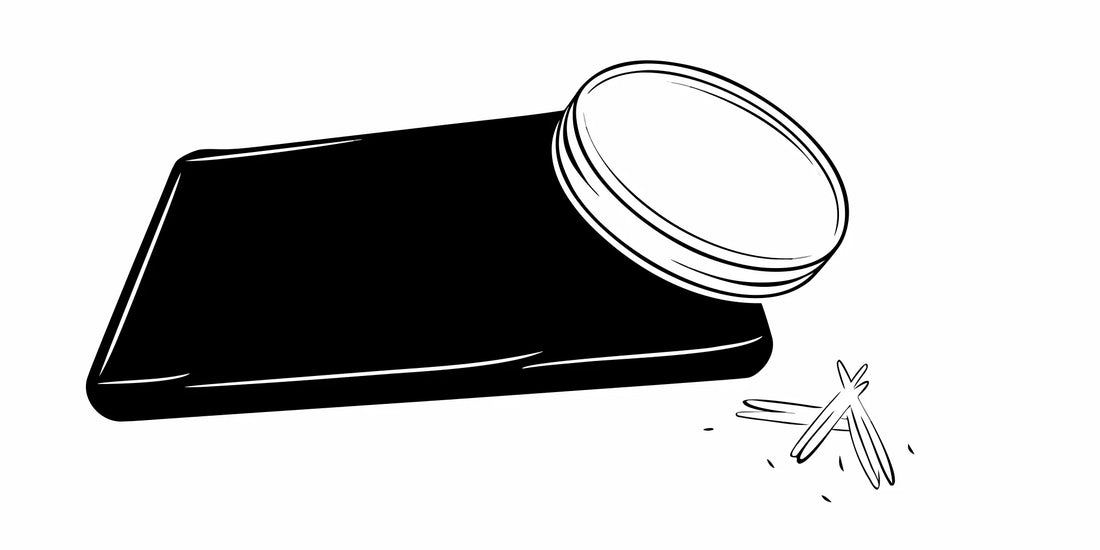 DALYSMOOTH sandalwood bourbon balm in an open tin with sandalwood sticks.