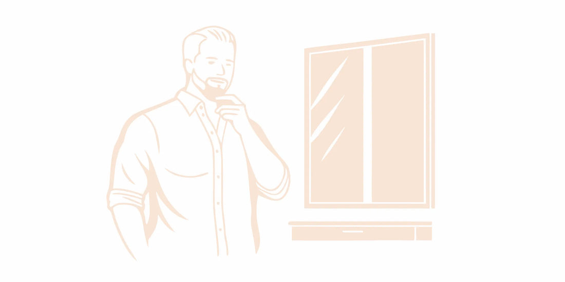 Man touching his beard while learning how to make it soft naturally.