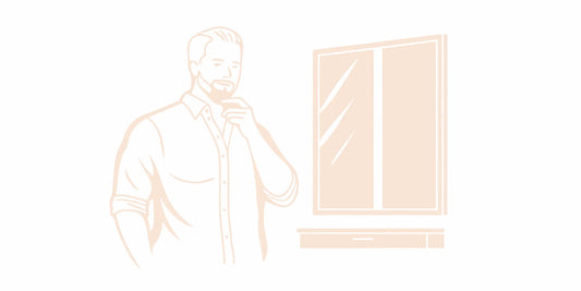 Man touching his beard while learning how to make it soft naturally.