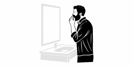 Man applying beard balm to soothe dry skin and beard.