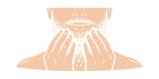 A man washing his beard using a gentle technique for sensitive skin.