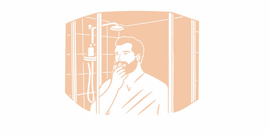 Bearded man using a moisturizing beard wash in the shower