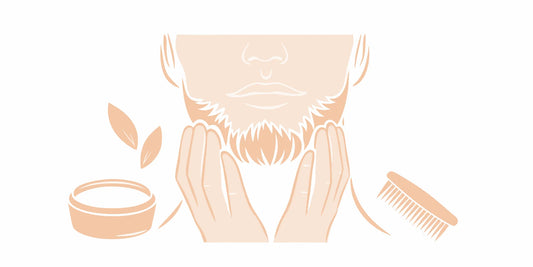 Hands applying natural sandalwood beard balm to a beard to soothe sensitive skin.