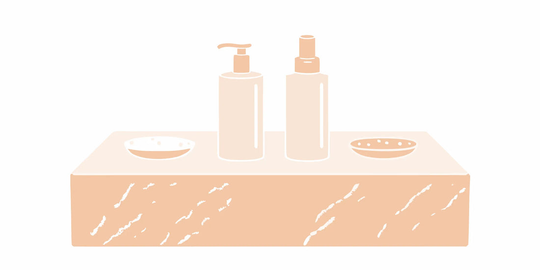 Men's face wash and other skincare products on a bathroom counter.