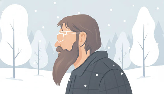 Man with a healthy, well-groomed winter beard outdoors in light snow